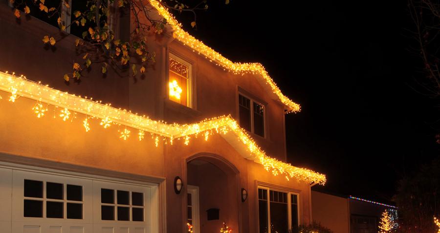 House decorated with Christmas lights at night